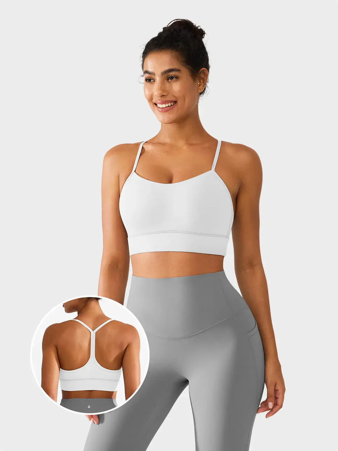 A model wearing a BRXL® Flow Y Racerback Bra with Low Cut and Spaghetti Straps in