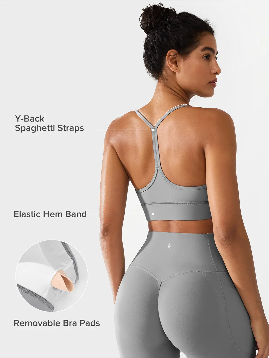 A model wearing a BRXL® Flow Y Racerback Bra with Low Cut and Spaghetti Straps