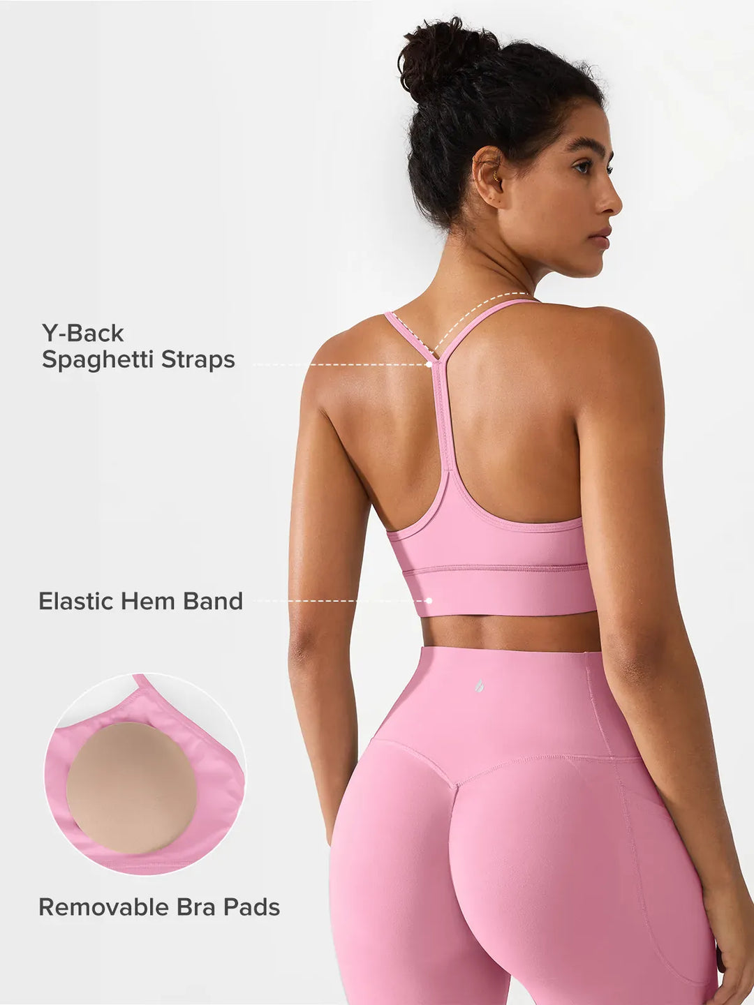 A model wearing a BRXL® Flow Y Racerback Bra with Low Cut and Spaghetti Straps