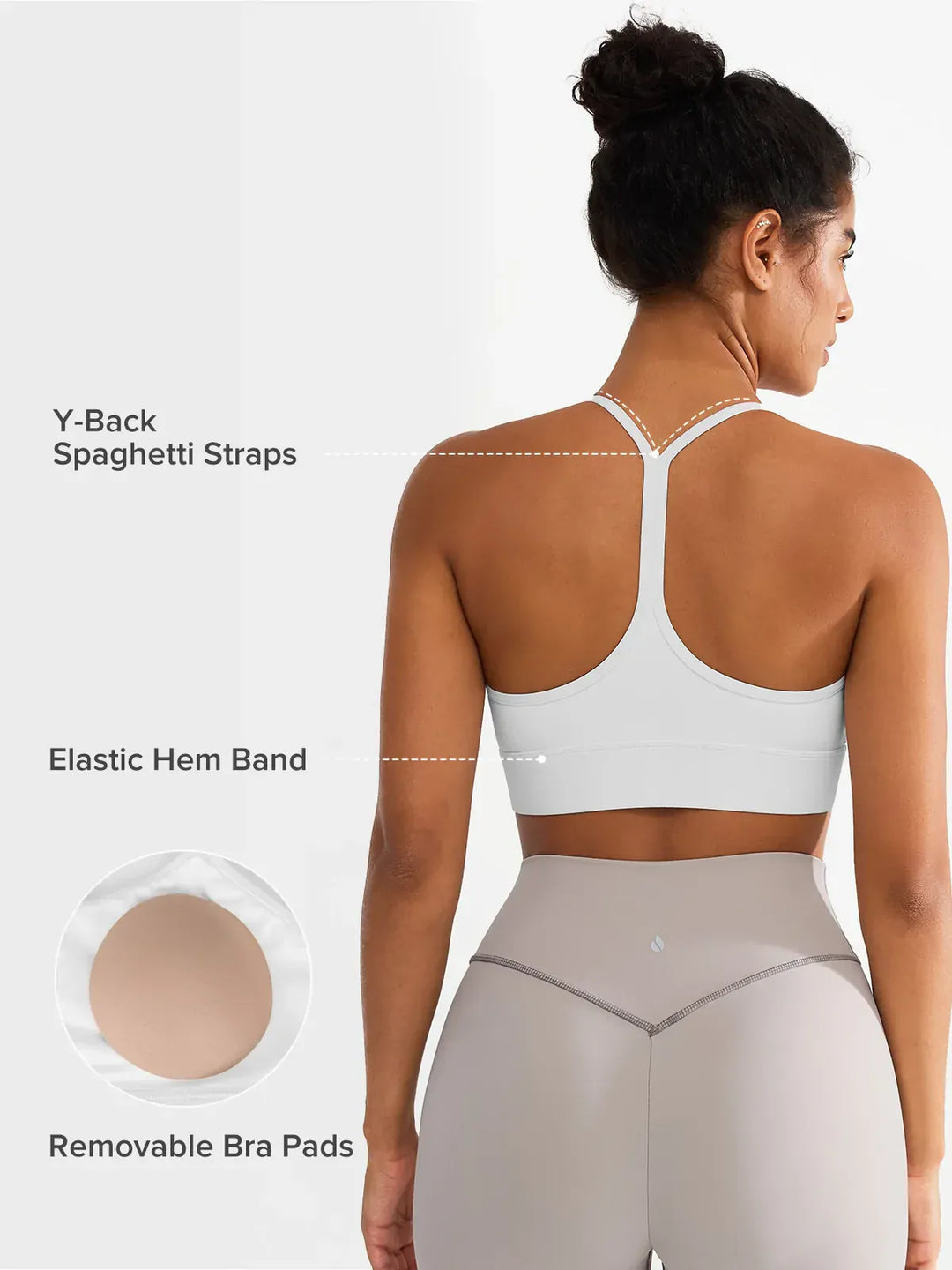 A model wearing a BRXL® Flow Y Racerback Bra with Low Cut and Spaghetti Straps