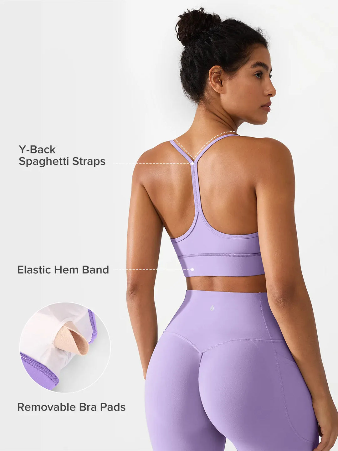 A model wearing a BRXL® Flow Y Racerback Bra with Low Cut and Spaghetti Straps