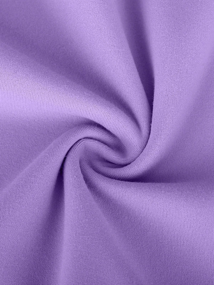 A model wearing a BRXL® Flow Y Racerback Bra with Low Cut and Spaghetti Straps in