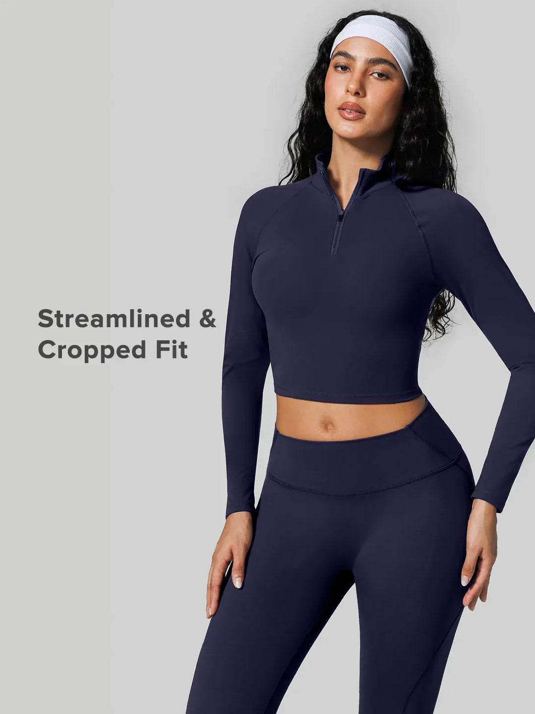 A model wearing a BRXL® Half Front Zipper Activewear Cropped Top