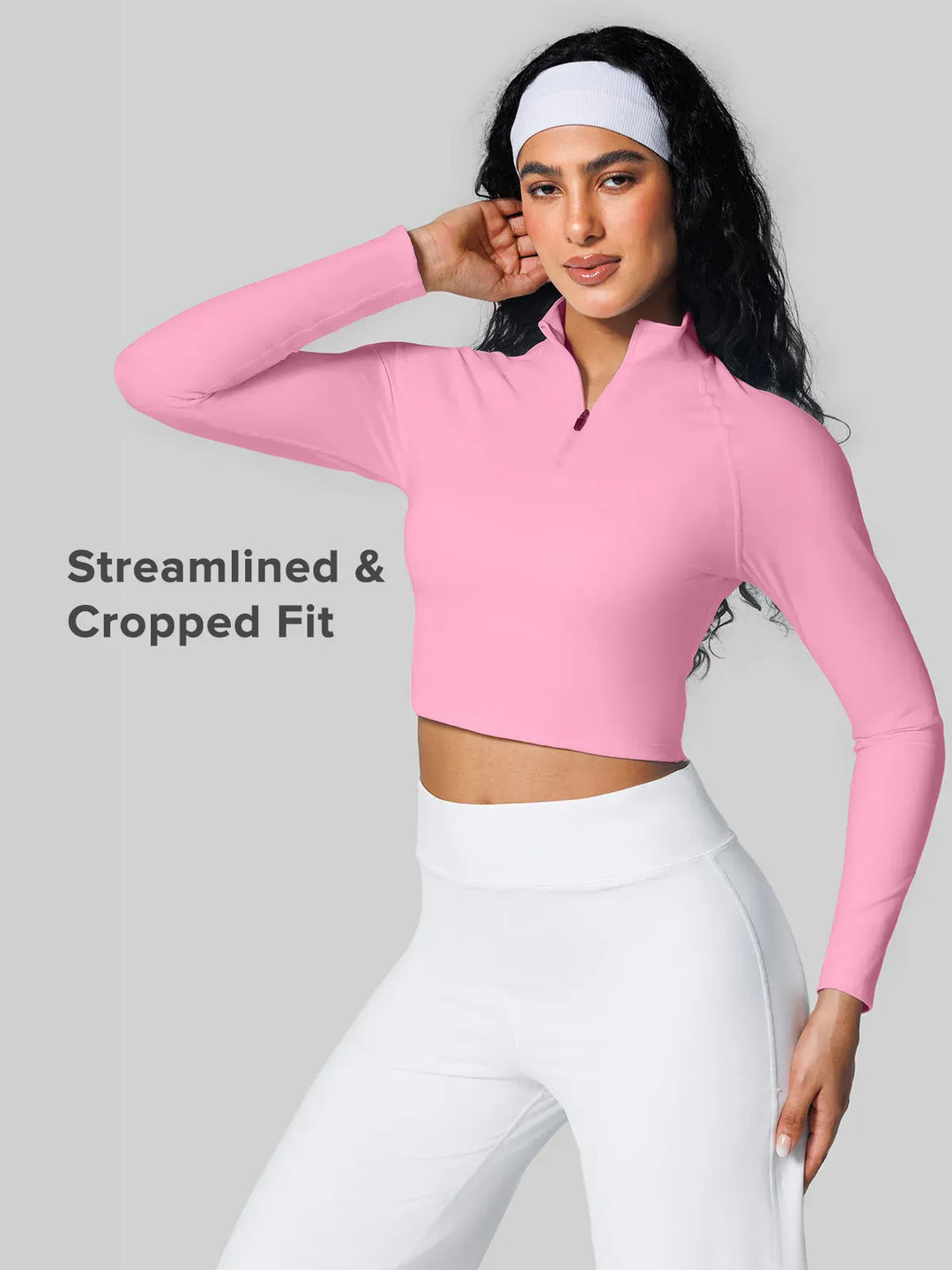 A model wearing a BRXL® Half Front Zipper Activewear Cropped Top in