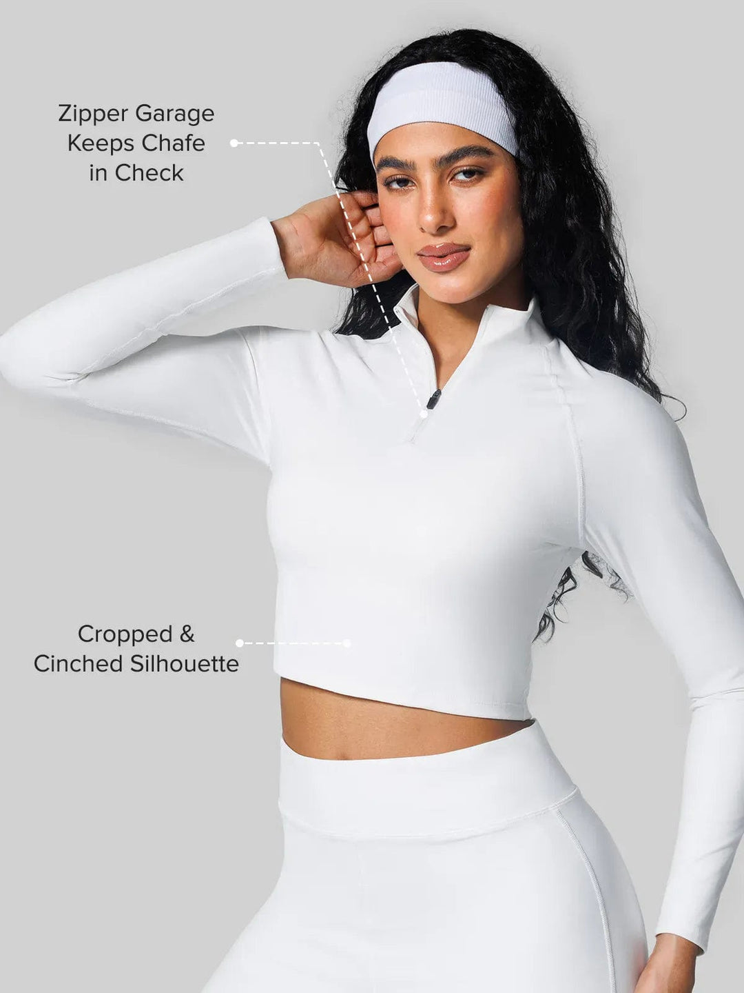 A model wearing a BRXL® Half Front Zipper Cropped Top Seamless Butt-Lifting Leggings Set in