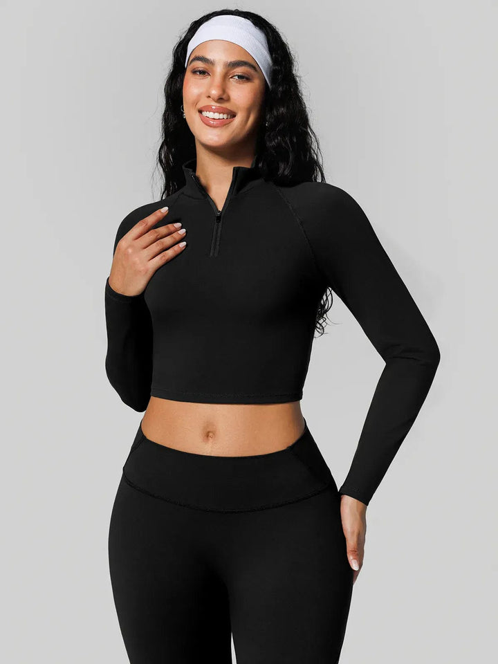 A model wearing a BRXL® Half Front Zipper Cropped Top Seamless Butt-Lifting Leggings Set in