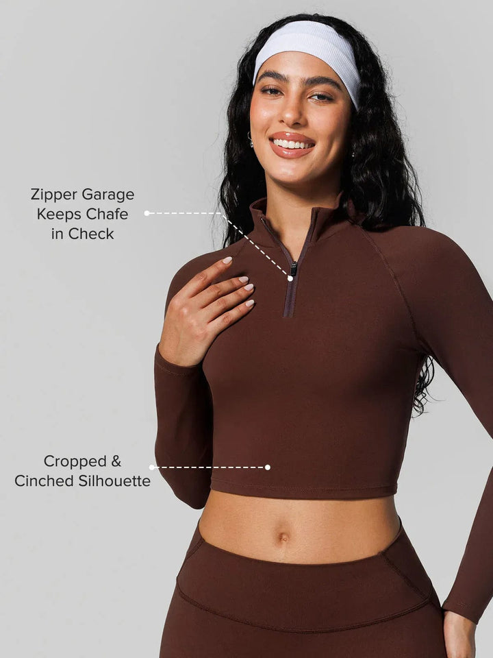 A model wearing a BRXL® Half Front Zipper Cropped Top Seamless Butt-Lifting Leggings Set in