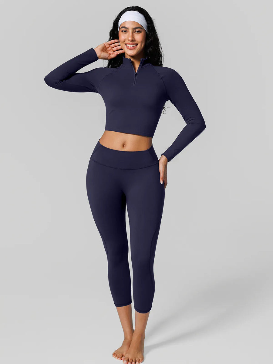A model wearing a BRXL® Half Front Zipper Cropped Top Side Pockets Fleece Lined Leggings Set in Set / Blue / XS