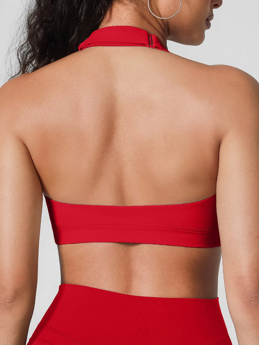 A model wearing a BRXL® Halter-neck Yoga Bra in