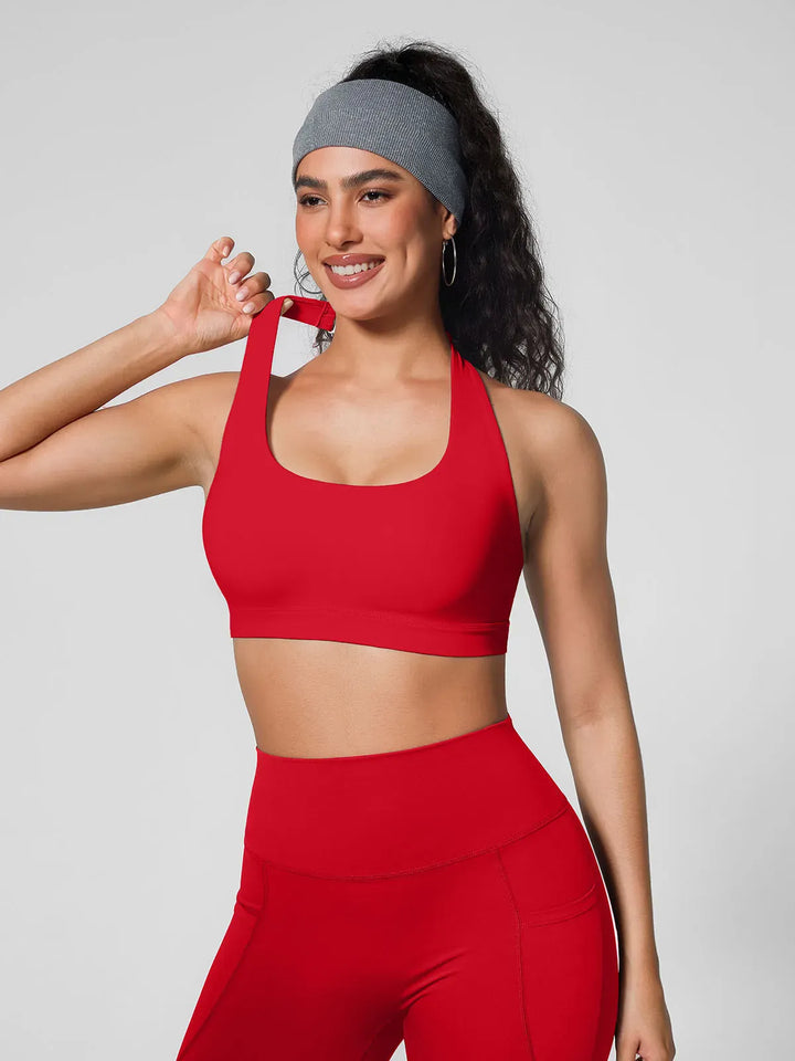 A model wearing a BRXL® Halter-neck Yoga Bra in