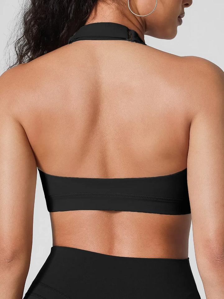 A model wearing a BRXL® Halter-neck Yoga Bra in