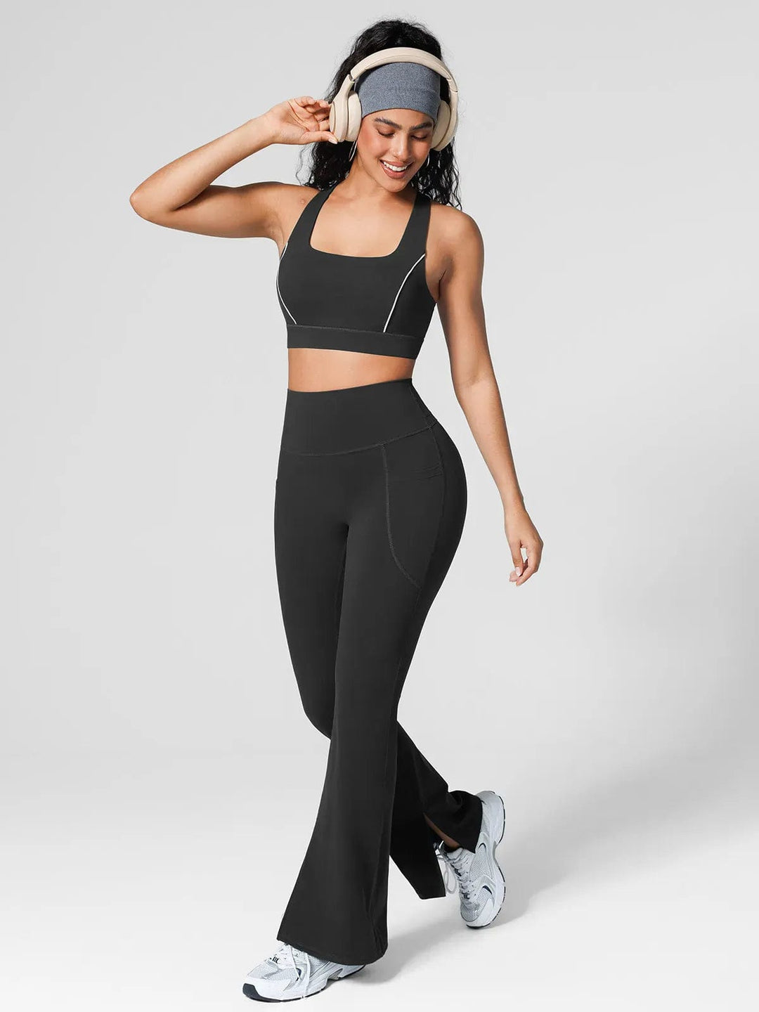 A model wearing a BRXL® Halter-neck Yoga Bra,High Rise Flared Side Pockets Scrunch Leggings in