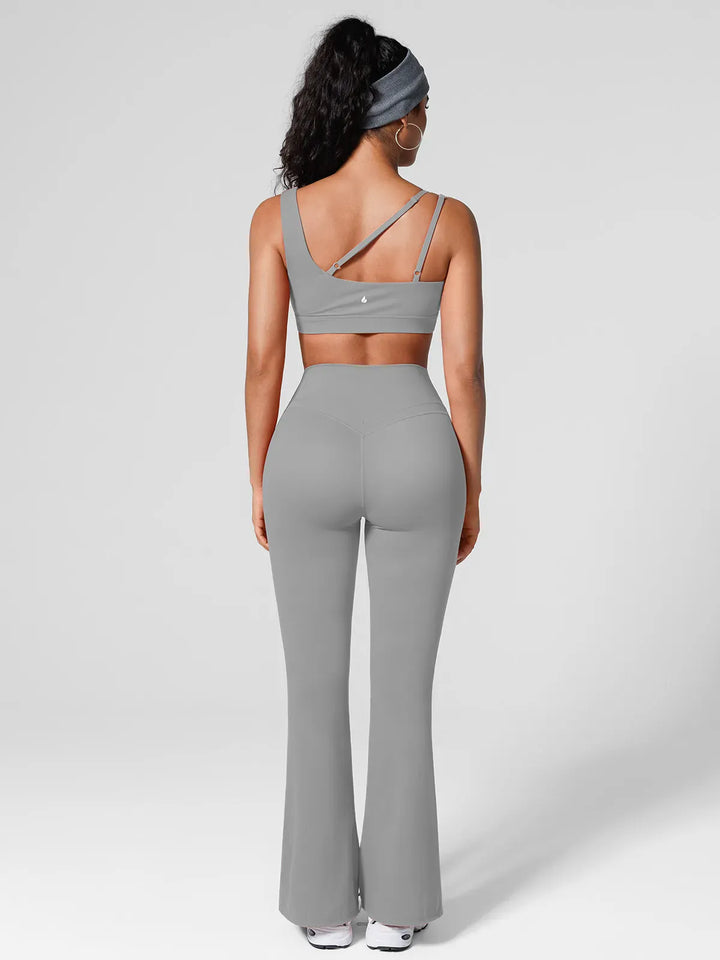 A model wearing a BRXL® High Rise Flared Side Pockets Scrunch Leggings in