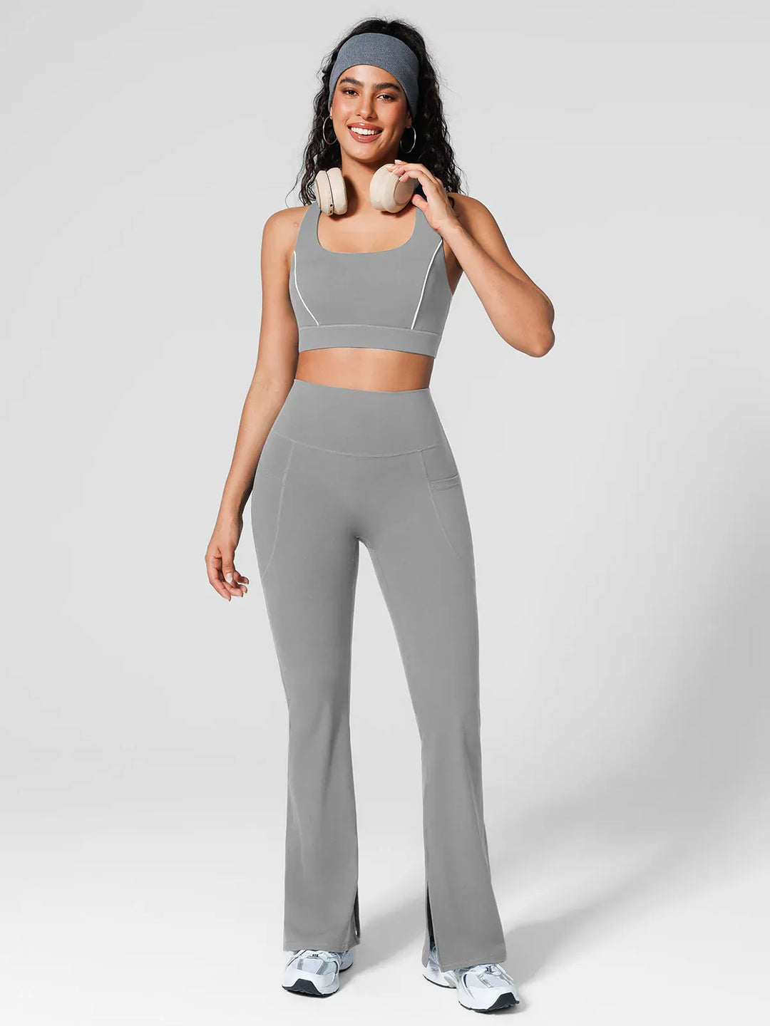 A model wearing a BRXL® High Rise Flared Side Pockets Scrunch Leggings