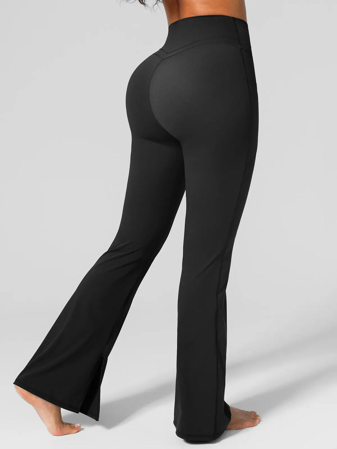 A model wearing a BRXL® High Rise Flared Side Pockets Scrunch Leggings