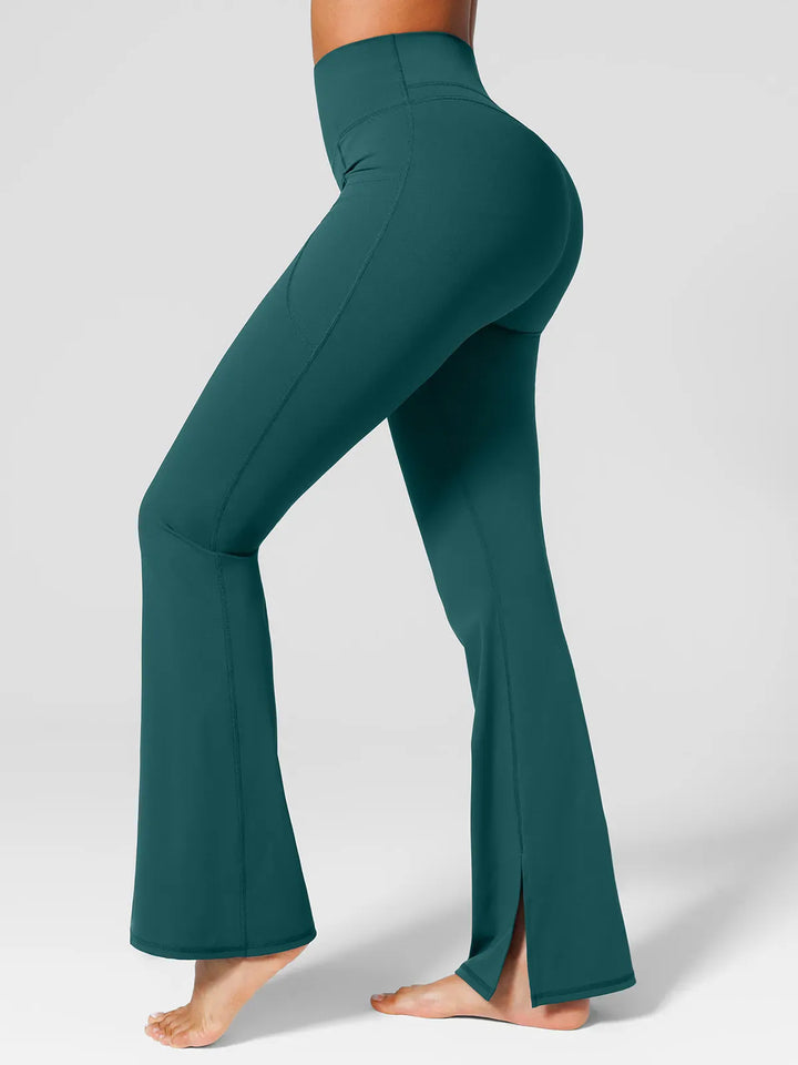 A model wearing a BRXL® High Rise Flared Side Pockets Scrunch Leggings Green / XS