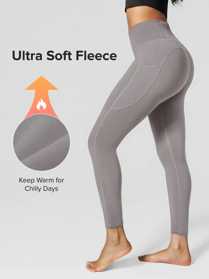 A model wearing a BRXL® High Rise Side Pockets Fleece Lined Leggings in