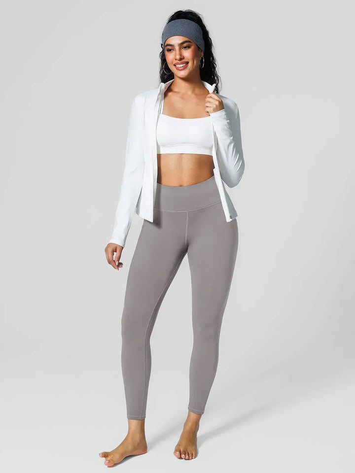 A model wearing a BRXL® High Rise Side Pockets Fleece Lined Leggings in