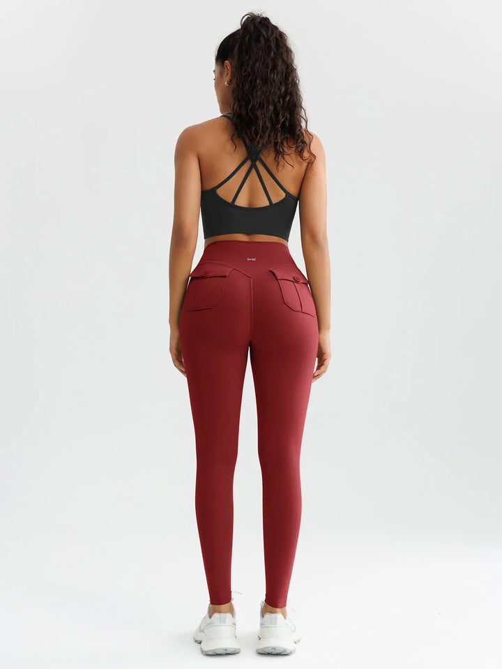 A model wearing a BRXL® High-Waisted Hidden Scrunch Leggings with Cargo Pockets
