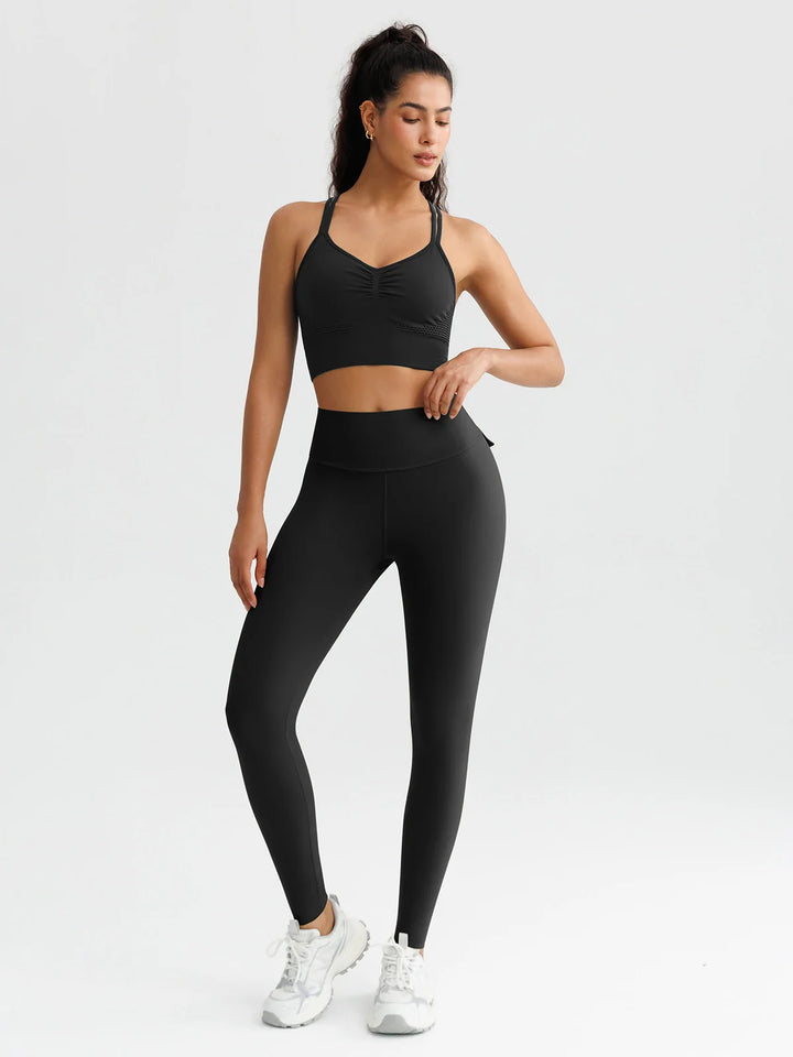 A model wearing a BRXL® High-Waisted Hidden Scrunch Leggings with Cargo Pockets