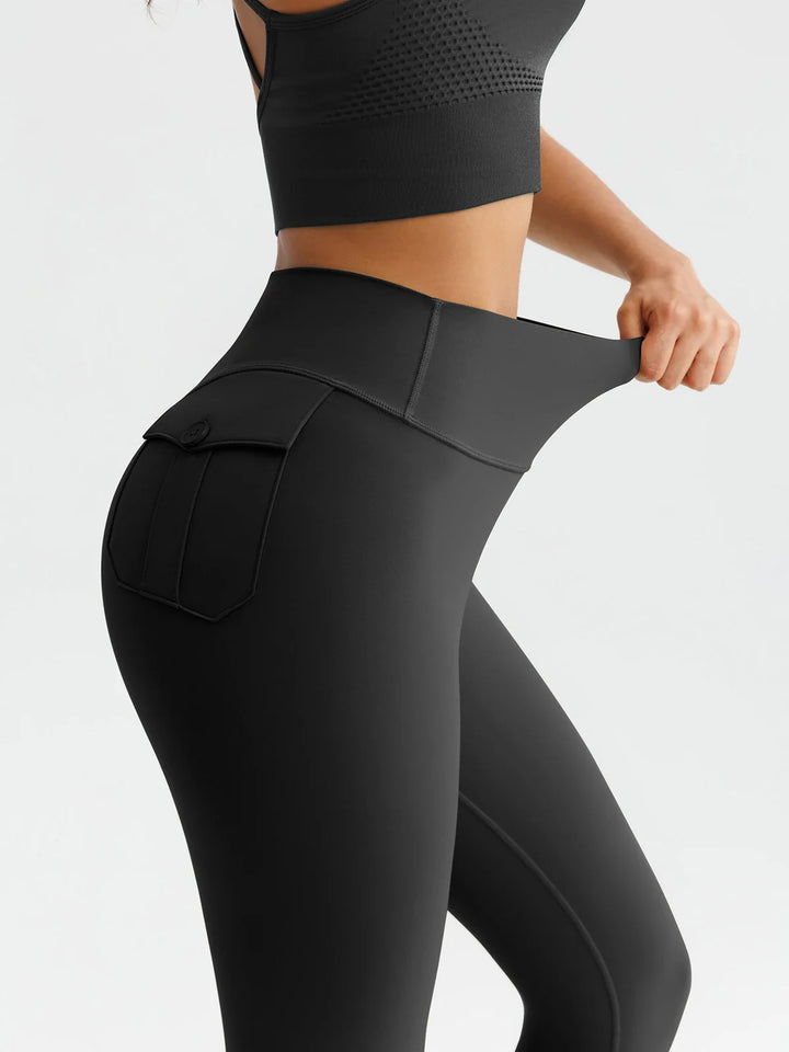 A model wearing a BRXL® High-Waisted Hidden Scrunch Leggings with Cargo Pockets