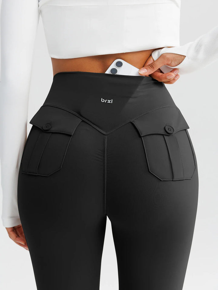 A model wearing a BRXL® High-Waisted Hidden Scrunch Leggings with Cargo Pockets