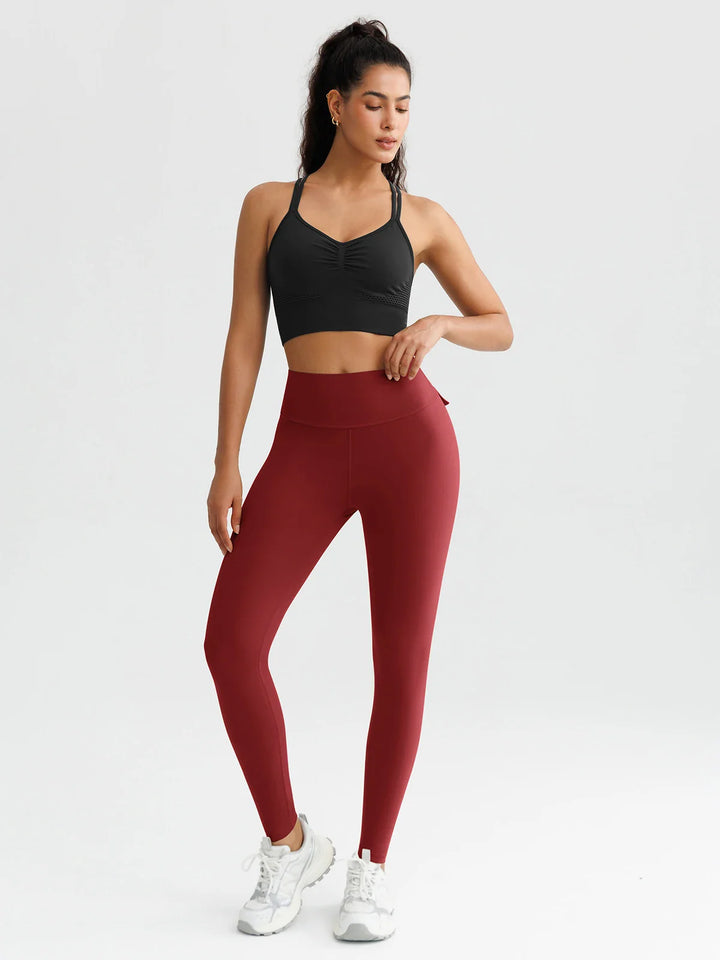 A model wearing a BRXL® High-Waisted Hidden Scrunch Leggings with Cargo Pockets