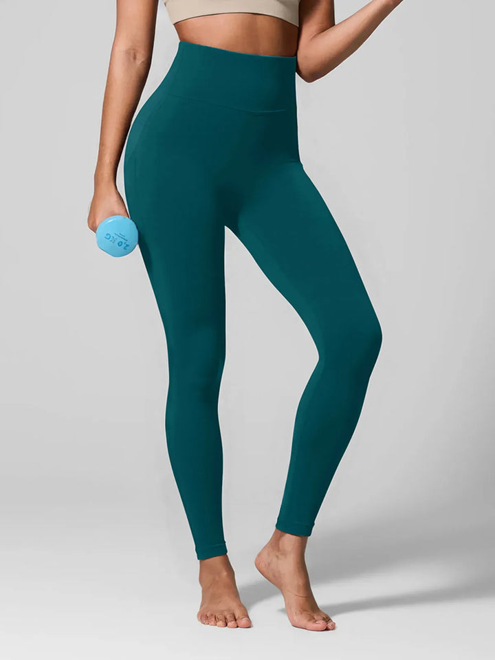 A model wearing a BRXL® High Waisted Seamless Triple layer Butt-Lifting Leggings With Tummy Control in