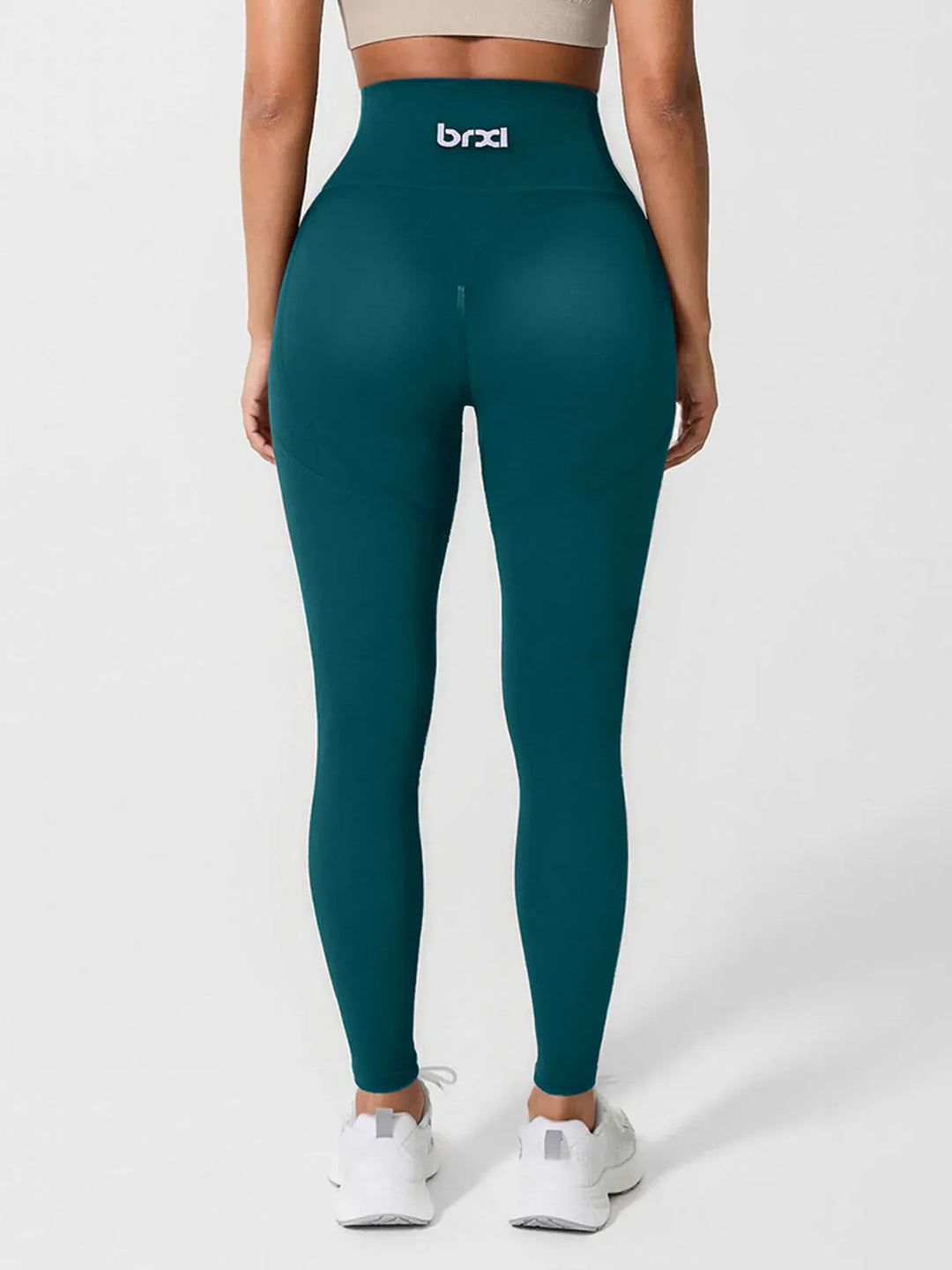 A model wearing a BRXL® High Waisted Seamless Triple layer Butt-Lifting Leggings With Tummy Control in