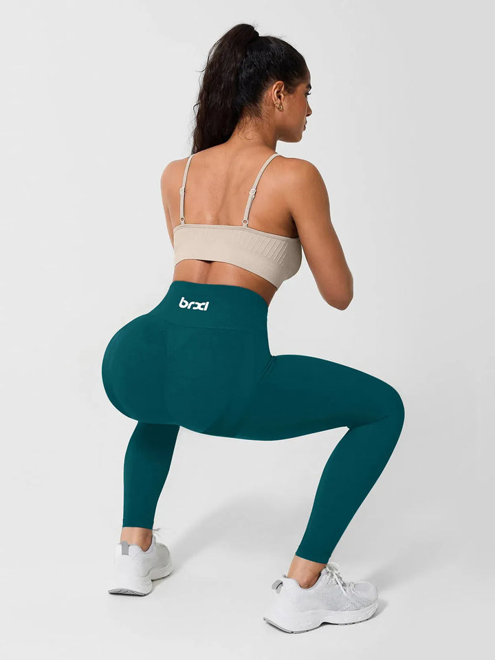 A model wearing a BRXL® High Waisted Seamless Triple layer Butt-Lifting Leggings With Tummy Control in
