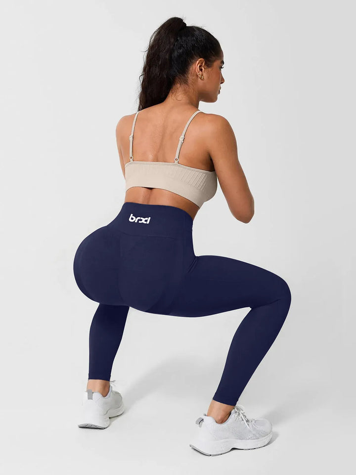 A model wearing a BRXL® High Waisted Seamless Triple layer Butt-Lifting Leggings With Tummy Control in