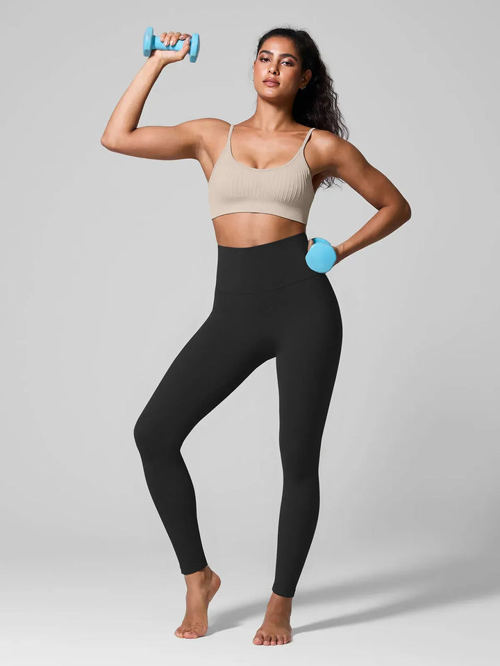A model wearing a BRXL® High Waisted Seamless Triple layer Butt-Lifting Leggings With Tummy Control in