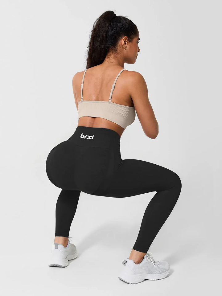 A model wearing a BRXL® High Waisted Seamless Triple layer Butt-Lifting Leggings With Tummy Control in