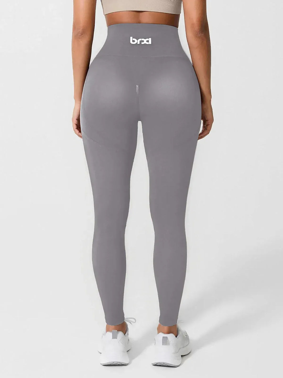 A model wearing a BRXL® High Waisted Seamless Triple layer Butt-Lifting Leggings With Tummy Control in