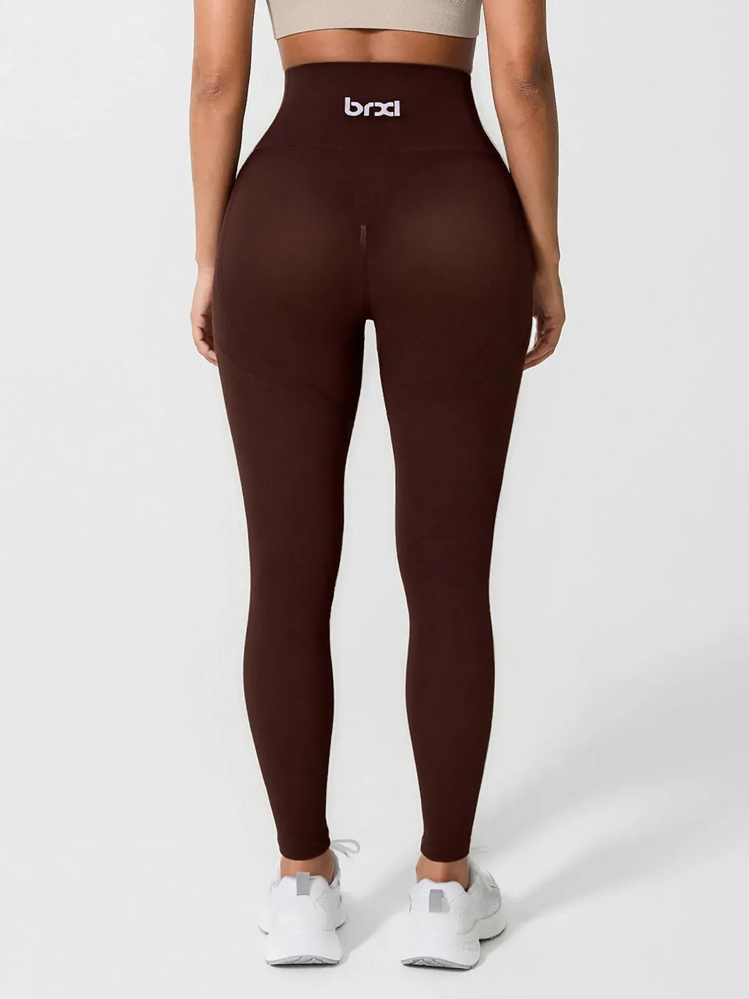 A model wearing a BRXL® High Waisted Seamless Triple layer Butt-Lifting Leggings With Tummy Control in