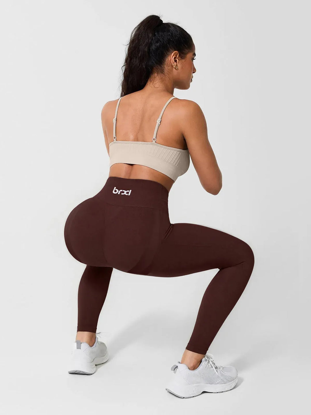 A model wearing a BRXL® High Waisted Seamless Triple layer Butt-Lifting Leggings With Tummy Control in
