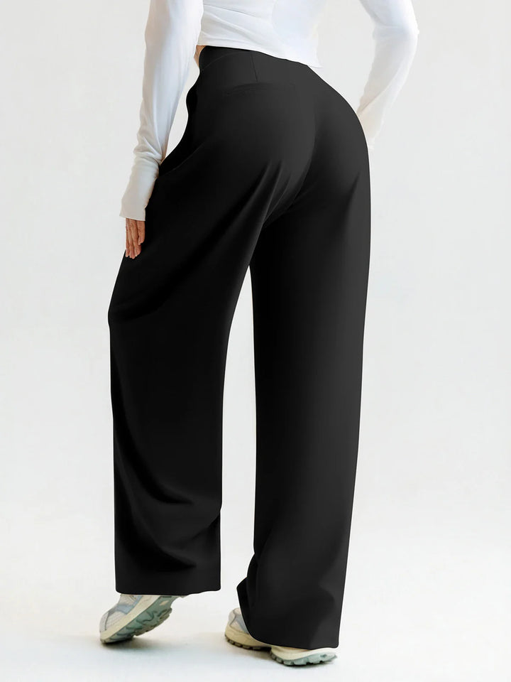 A model wearing a BRXL® High Waisted Straight Leg Commuter Pants With Pockets
