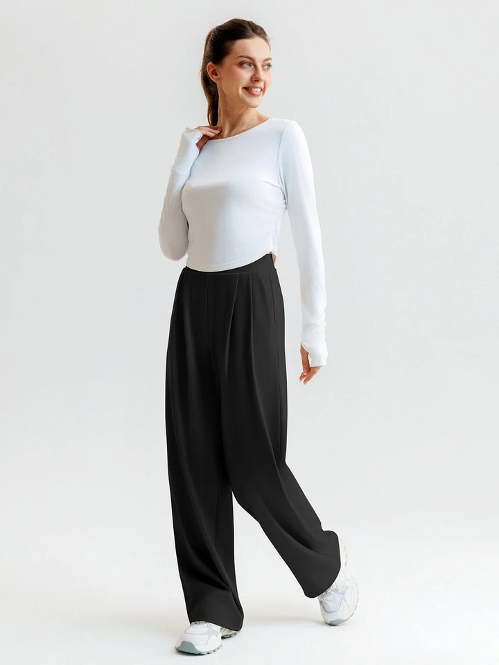 A model wearing a BRXL® High Waisted Straight Leg Commuter Pants With Pockets