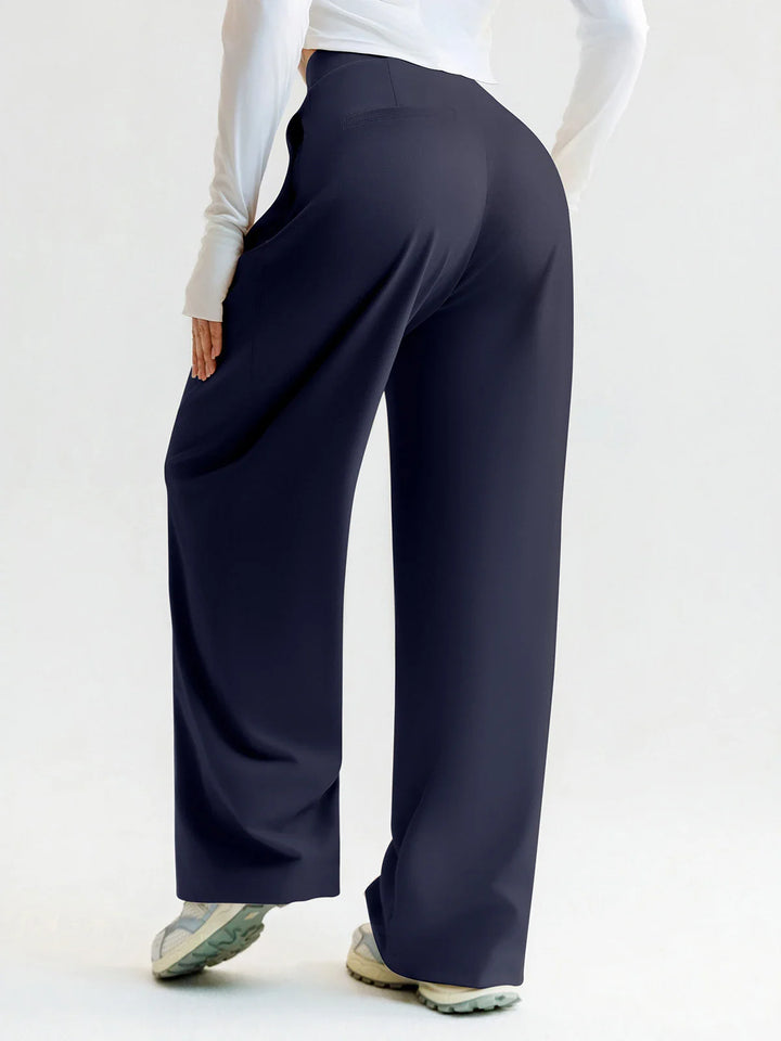 A model wearing a BRXL® High Waisted Straight Leg Commuter Pants With Pockets