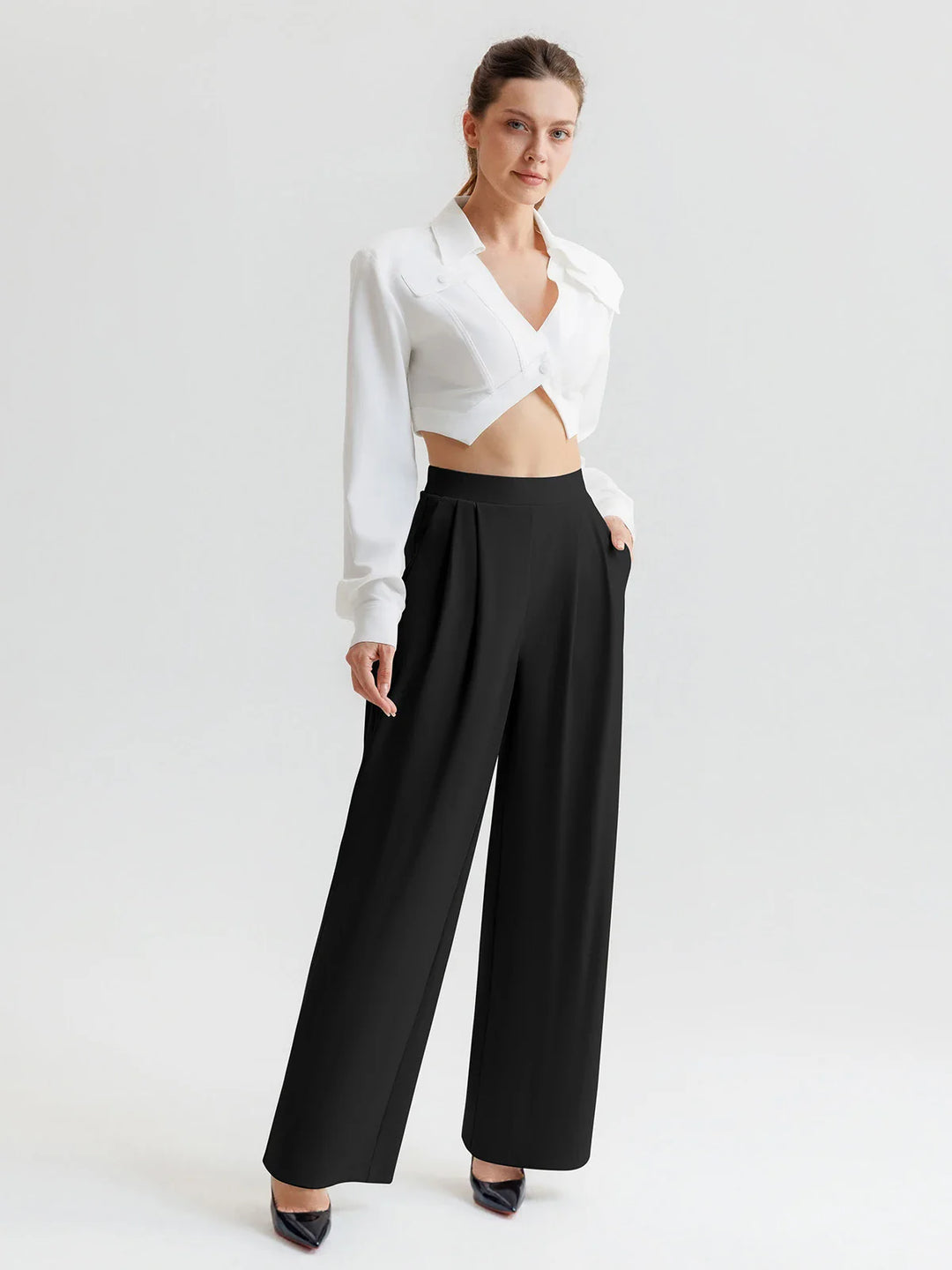 A model wearing a BRXL® High Waisted Straight Leg Commuter Pants With Pockets