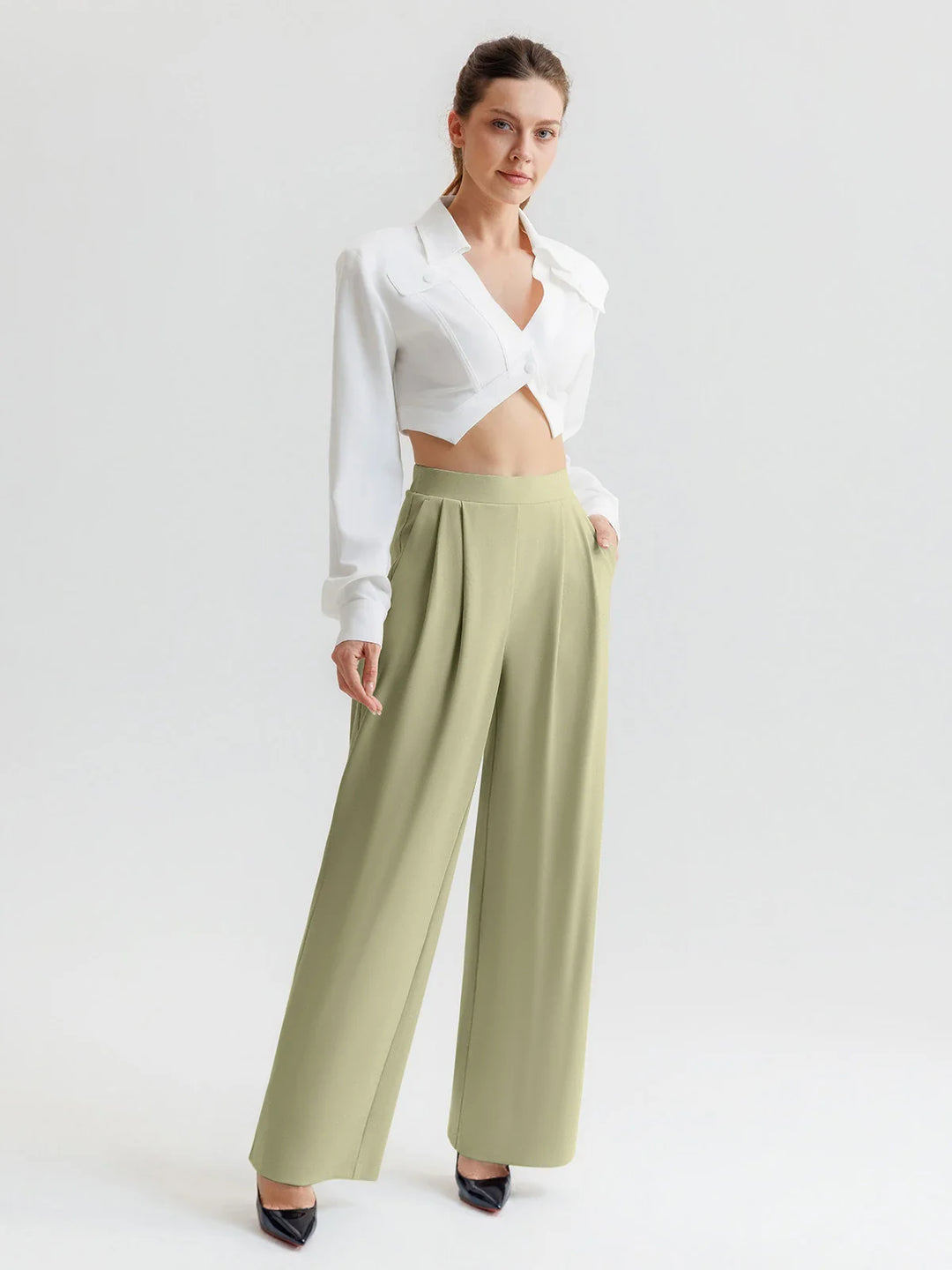 A model wearing a BRXL® High Waisted Straight Leg Commuter Pants With Pockets