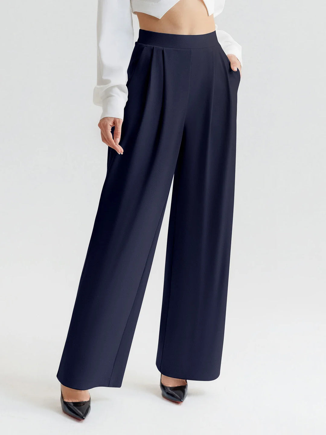 A model wearing a BRXL® High Waisted Straight Leg Commuter Pants With Pockets Petite / Navy Blue / XS
