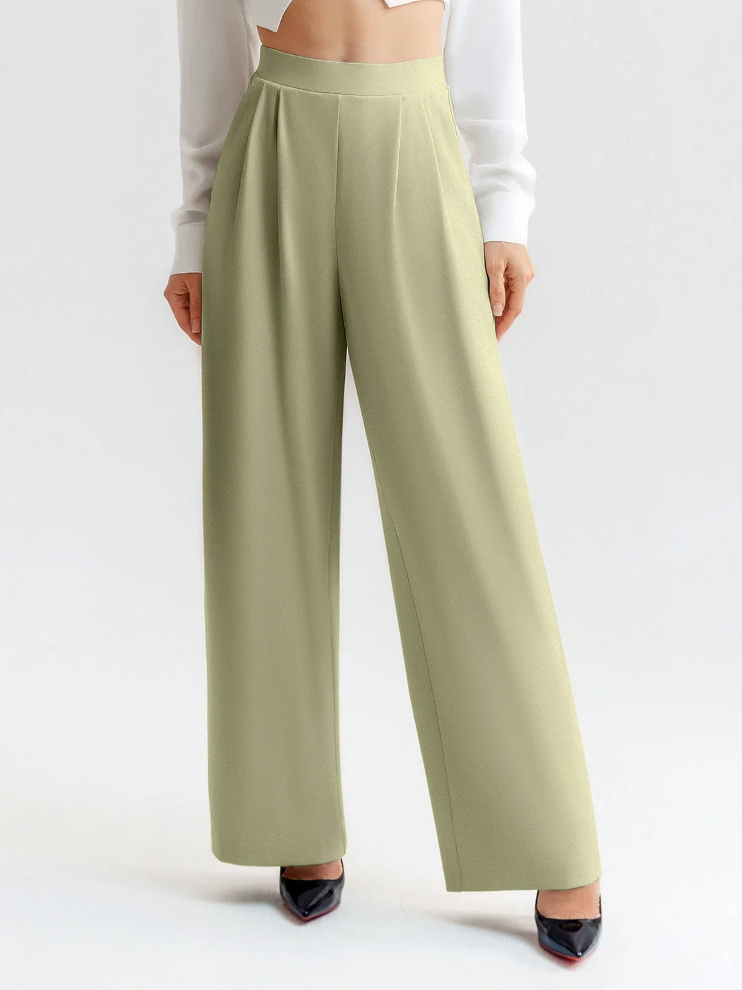 A model wearing a BRXL® High Waisted Straight Leg Commuter Pants With Pockets Regular / Mustard Green / XS