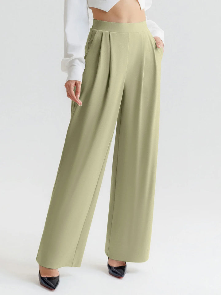 A model wearing a BRXL® High Waisted Straight Leg Commuter Pants With Pockets Tall / Mustard Green / XS