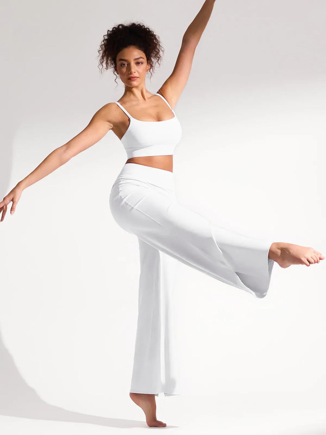 A model wearing a BRXL® High Waisted Wide Leg Hidden Pockets Yoga Pants in