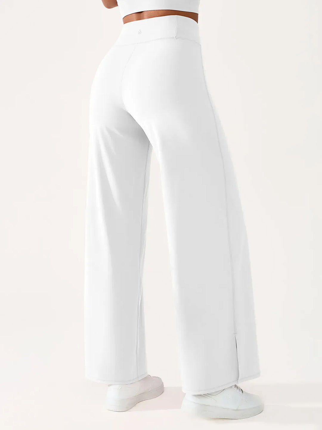 A model wearing a BRXL® High Waisted Wide Leg Hidden Pockets Yoga Pants