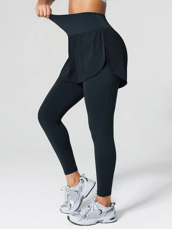 A model wearing a BRXL® Layered Combo Short Leggings in