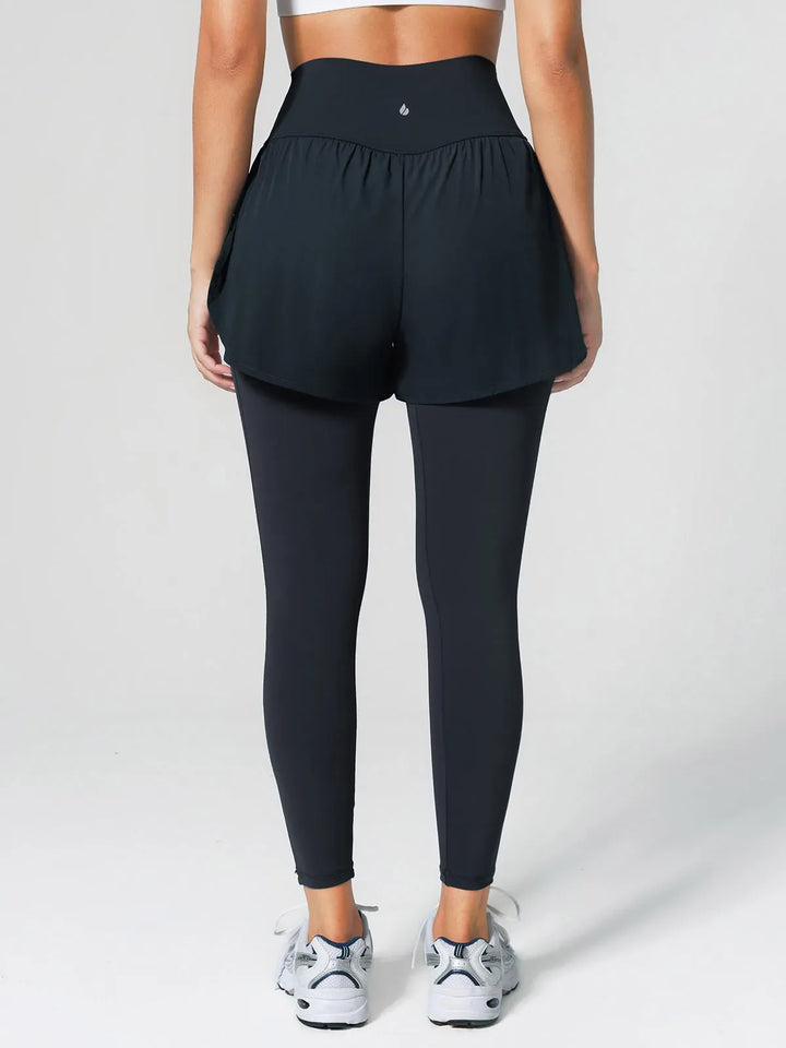 A model wearing a BRXL® Layered Combo Short Leggings in
