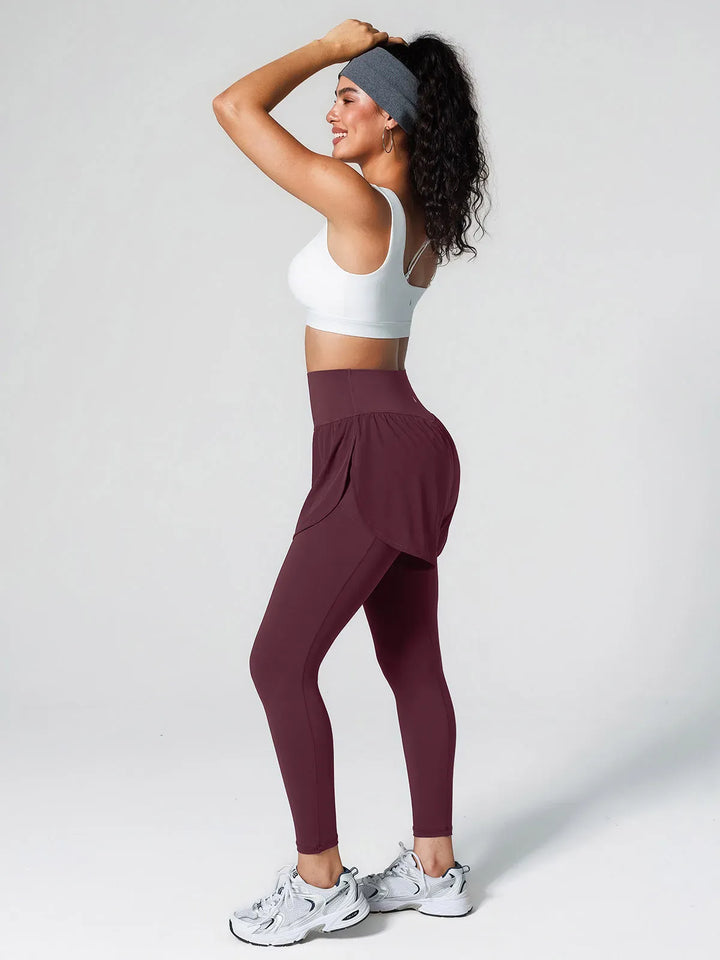 A model wearing a BRXL® Layered Combo Short Leggings in