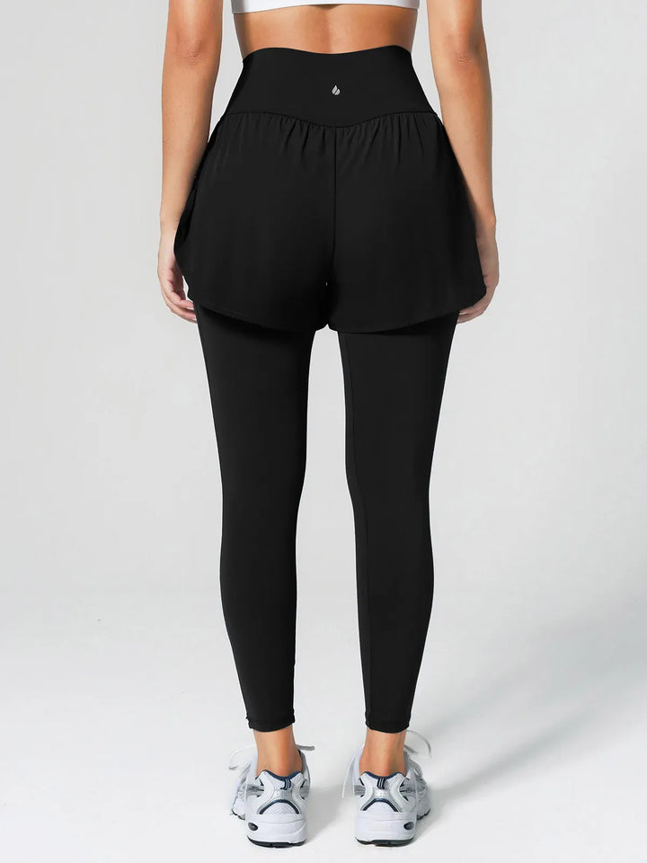 A model wearing a BRXL® Layered Combo Short Leggings in